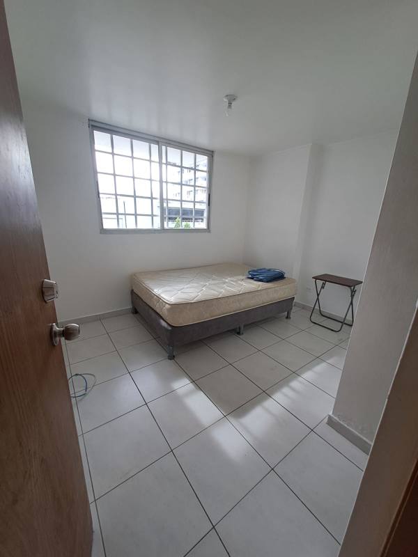 Small bedroom with tile floor, window and neutral decor in Don Bosco PH Llano Bonito