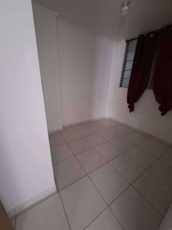 Compact bathroom with checkered curtain and basic fixtures in PH Llano Bonito Don Bosco