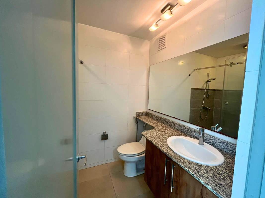 Modern bathroom granite countertop and walk-in shower PH Via Porras Panama