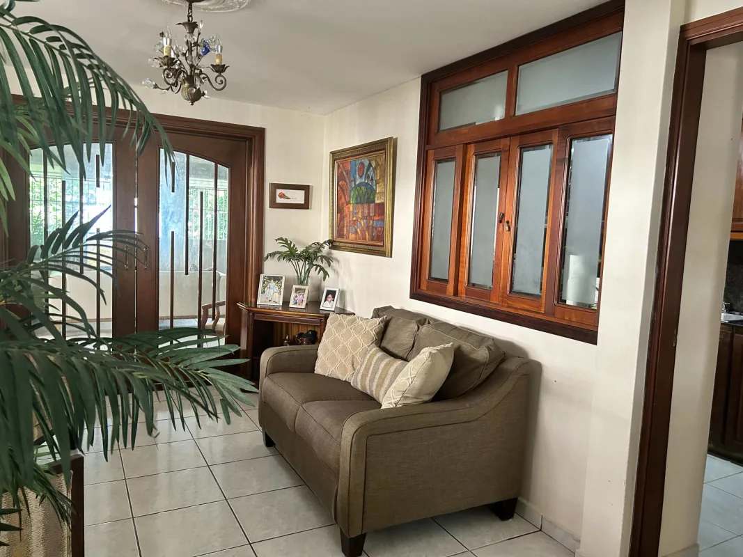 Traditional living room with glass paneled doors, large windows in PH Torres de Toscana Panama