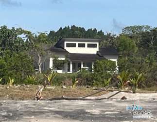 Open-concept modern kitchen with granite countertops in Rincon Beach luxury villa