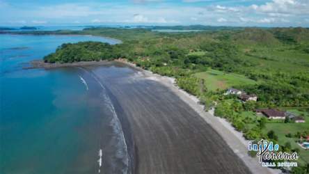 Aerial coastal view of Gulf of Chiriquí, sandy beach, lush green near Boca Chica Panama
