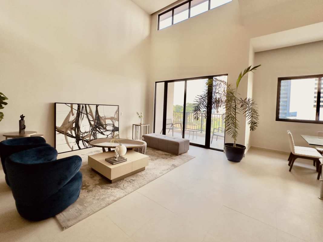 Elegant modern bedroom with large sliding glass doors opening to balcony city views in PH Casa Bianca Costa del Este