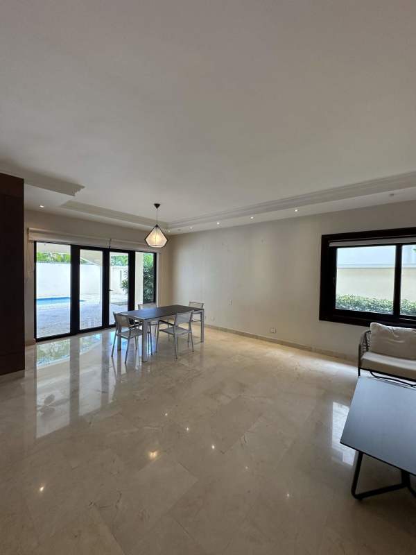 Covered terrace with ceiling fans overlooking private swimming pool and garden Las Camelias home for rent