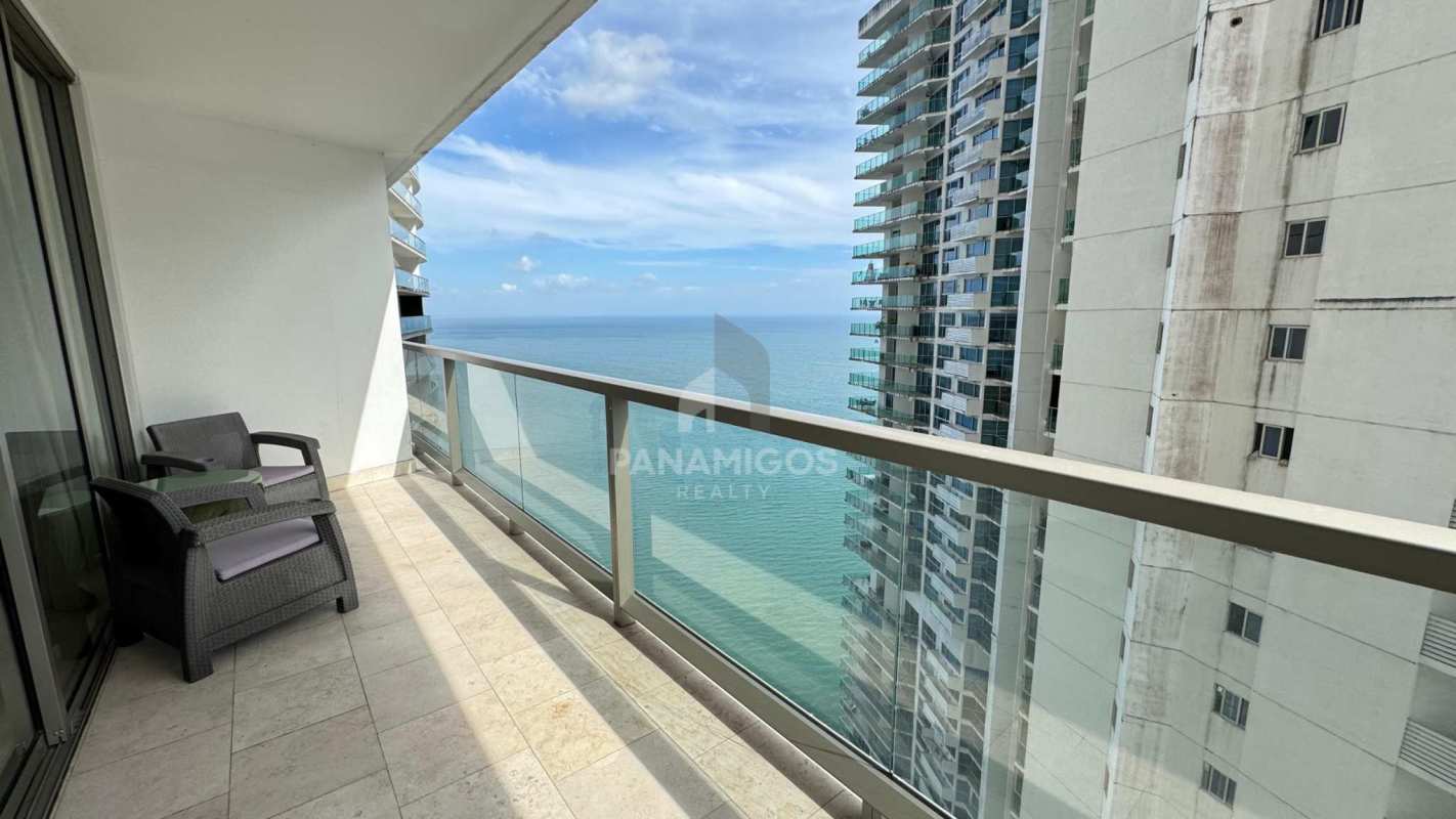 Large bedroom with floor-to-ceiling windows offering ocean views in luxury condo The Ocean Club Punta Pacífica Panama