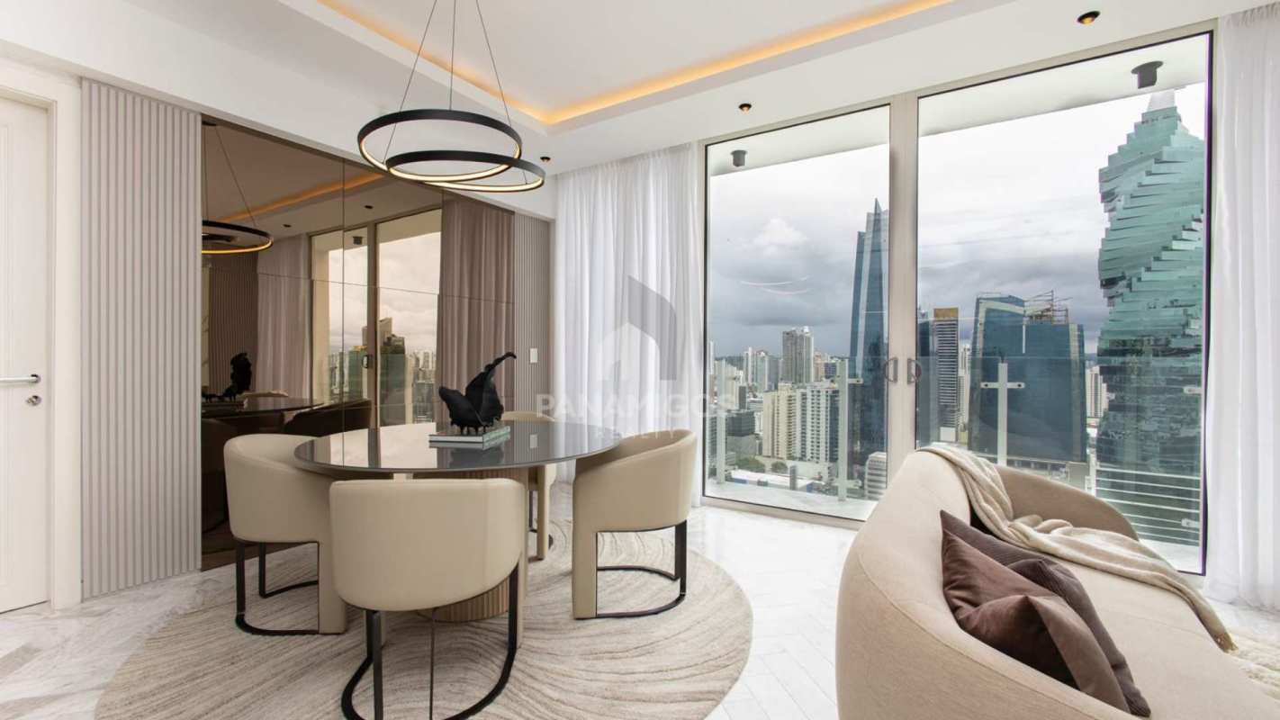 Elegant dining room with full-height city view windows Wanders and Yoo Panama City