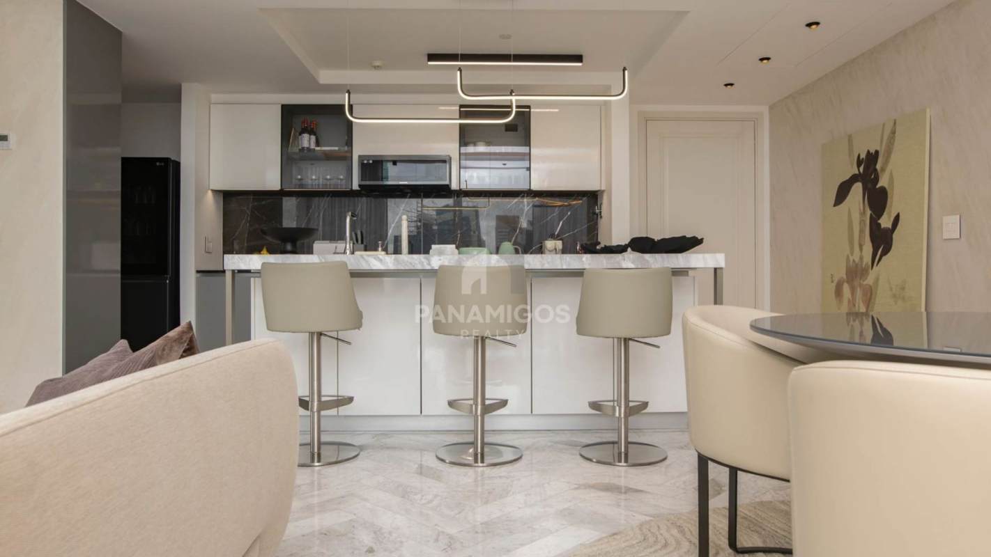 Modern open living room with stunning city views, neutral palette, luxury finishes in Wanders Yoo Marbella Panama