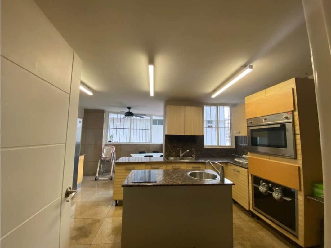 Traditional furnished bedroom with tufted bed, chandelier and window with curtains PH Ritz Paitilla