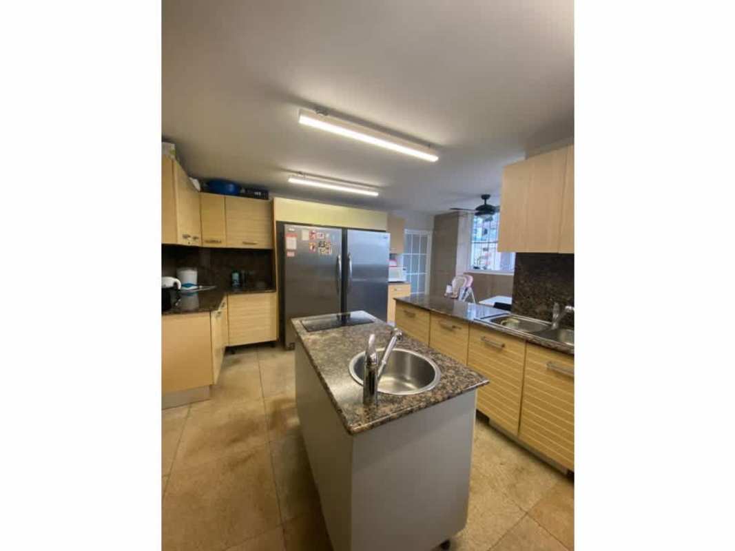 Modern kitchen with island, granite countertops and appliances PH Ritz Punta Paitilla