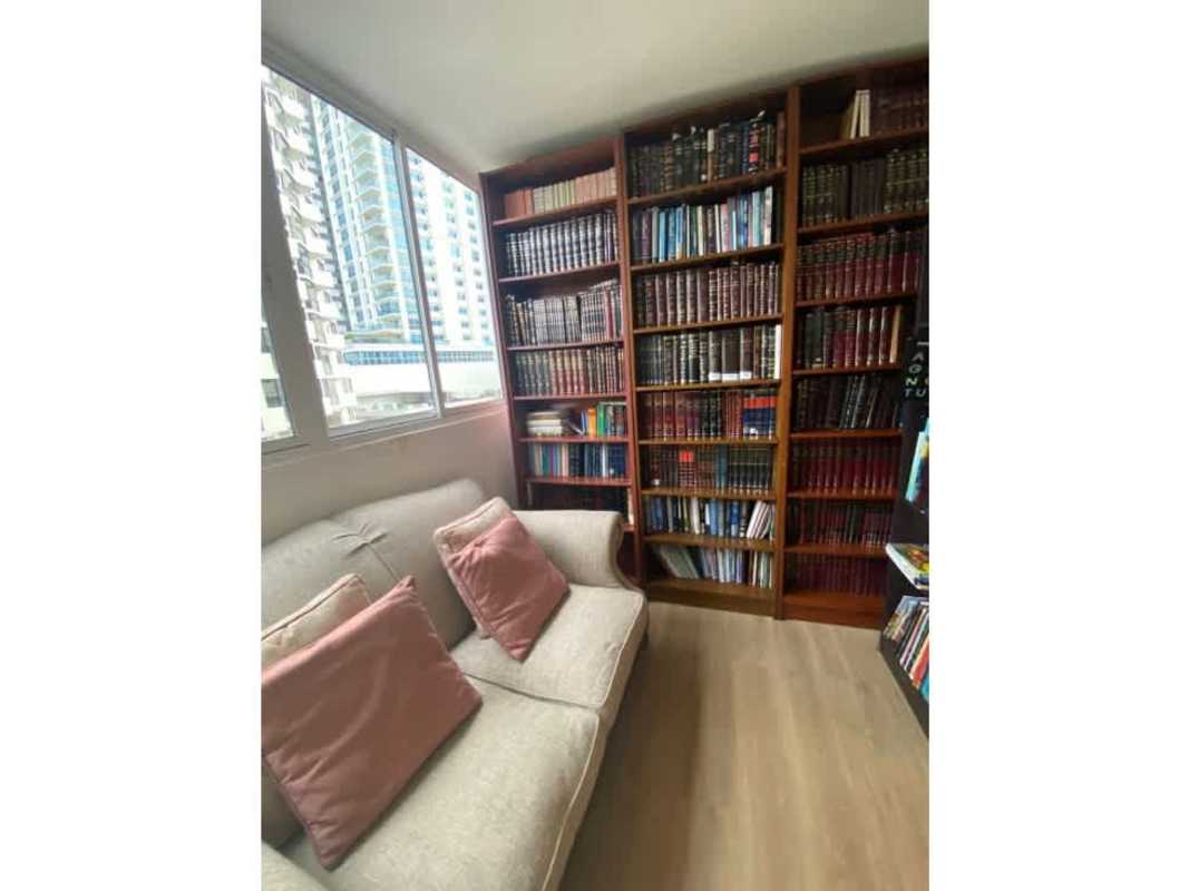 Library or study room with sofa and large windows at PH Ritz Punta Paitilla Panama