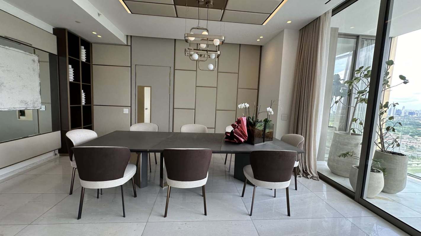 Wraparound balcony with glass railing overlooking golf course and skyline in Panama