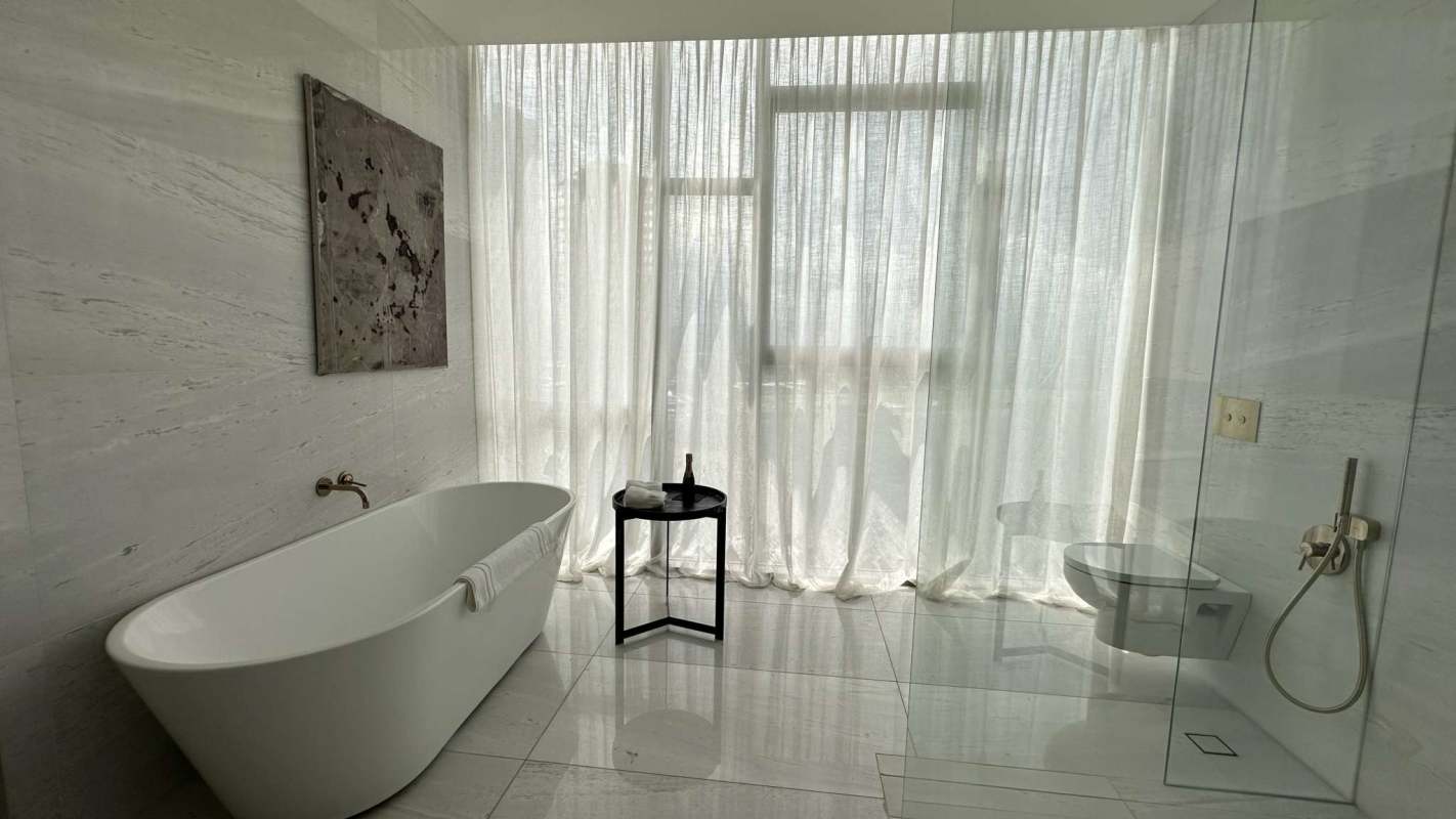 Master bedroom with floor-to-ceiling windows and sweeping golf course ocean views PH Fendi Casa Tower Panama