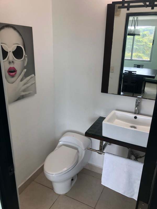 Modern bathroom with glass enclosed shower and vanity PH Clayton Park Panama City