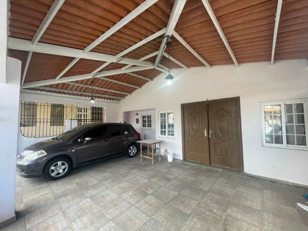 Functional kitchen with cabinets, gas stove, microwave in Villa Lucre Panama house