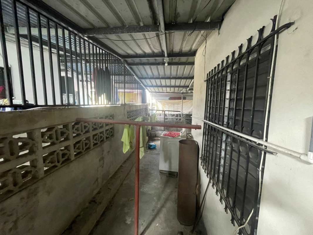 Front of Villa Lucre house for sale with gated carport and driveway