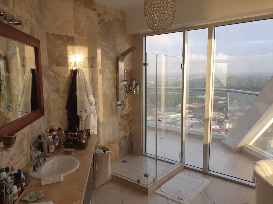 Contemporary bathroom with double sink glass shower marble surfaces PH Rivage Panama