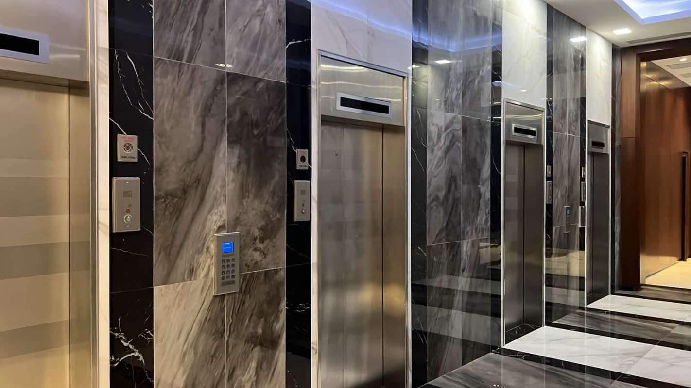 Multiple elevators with access control panel marble accent PH Financial Park commercial tower Obarrio Panama