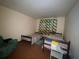 Bathroom with pedestal sink, tub, mirror cabinet rural house Capira