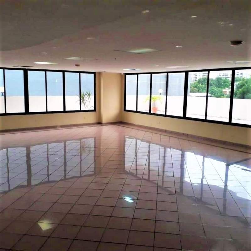 Bedroom with ceramic tile floor, built-in closets, large window city view in PH Arrecife Panama