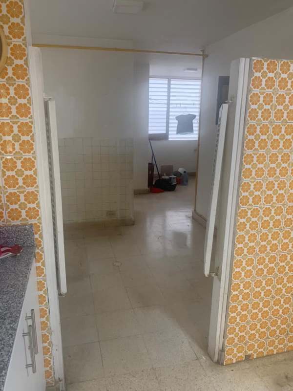 Kitchen with granite counter, vintage patterned tiles leading to utility PH Marina Plaza