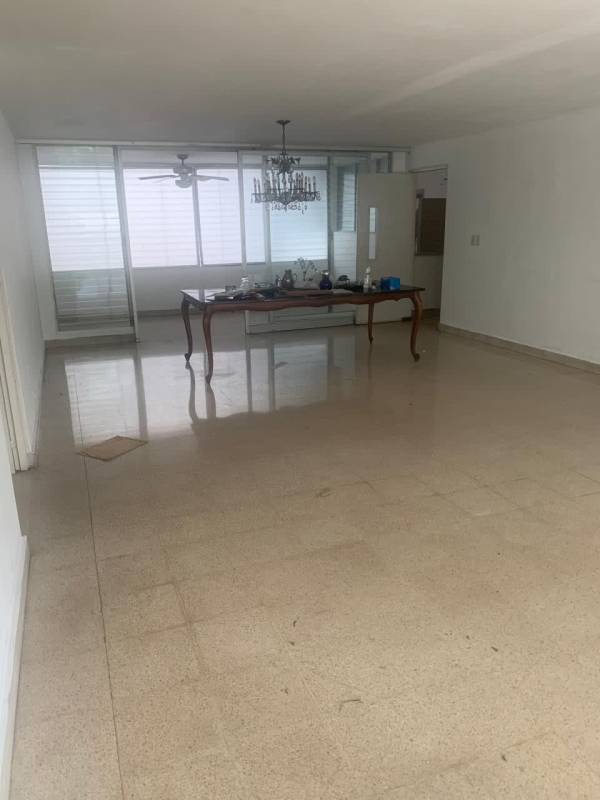 Dining area with chandelier, large windows and tile flooring in PH Marina Plaza
