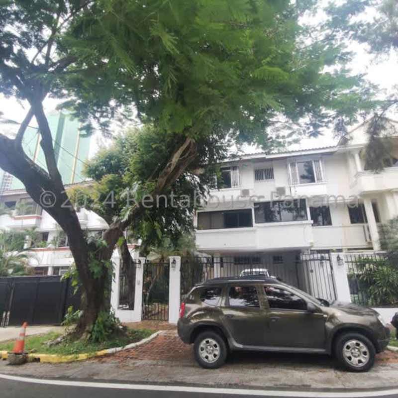 Spacious covered terrace with jacuzzi overlooking the lush garden of a Panama home
