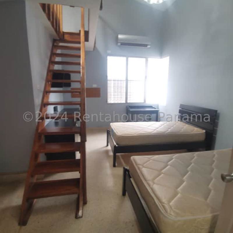 Spacious kitchen with granite countertops and custom cabinets in Panama City house