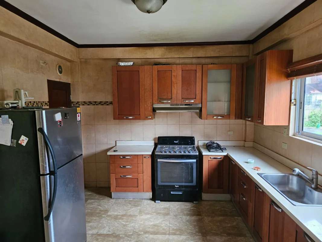 Bathroom with granite countertop, vessel sink, tile wall, framed mirror at PH Torres de Toscana Panama