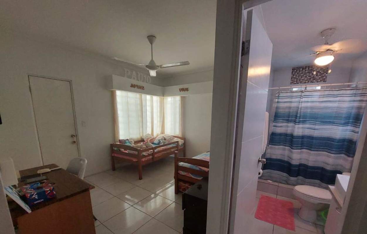 Secondary bedroom with natural light and minimalist decor in PH Torres de Toscana Panama