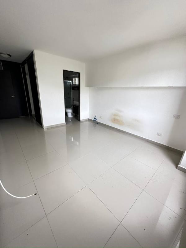 Modern kitchen with granite countertops dark cabinetry and tiled floors PH Altamira Gardens Ancon Panama