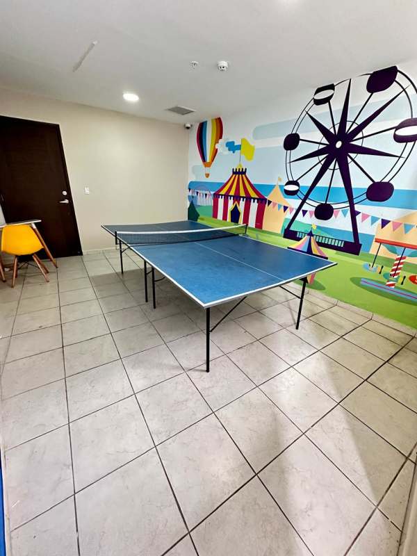 Living room with large windows and partial ocean view PH Bay View Avenida Balboa Panama City