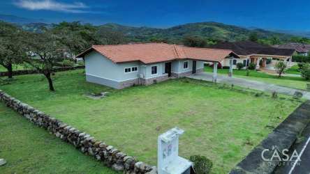 Furnished living-dining area with tile floors and breakfast bar Boquete Canyon Village Panama