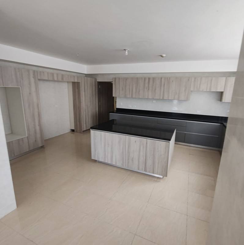 Luxury kitchen with island, granite countertops, ample cabinetry in Punta Paitilla condo
