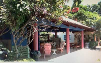 Covered patio with outdoor dining picnic tables lush garden in Coronado Panama Villas Monserrat