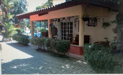 Traditional house with porch garden plants and tile roof multi-unit complex Villas Monserrat