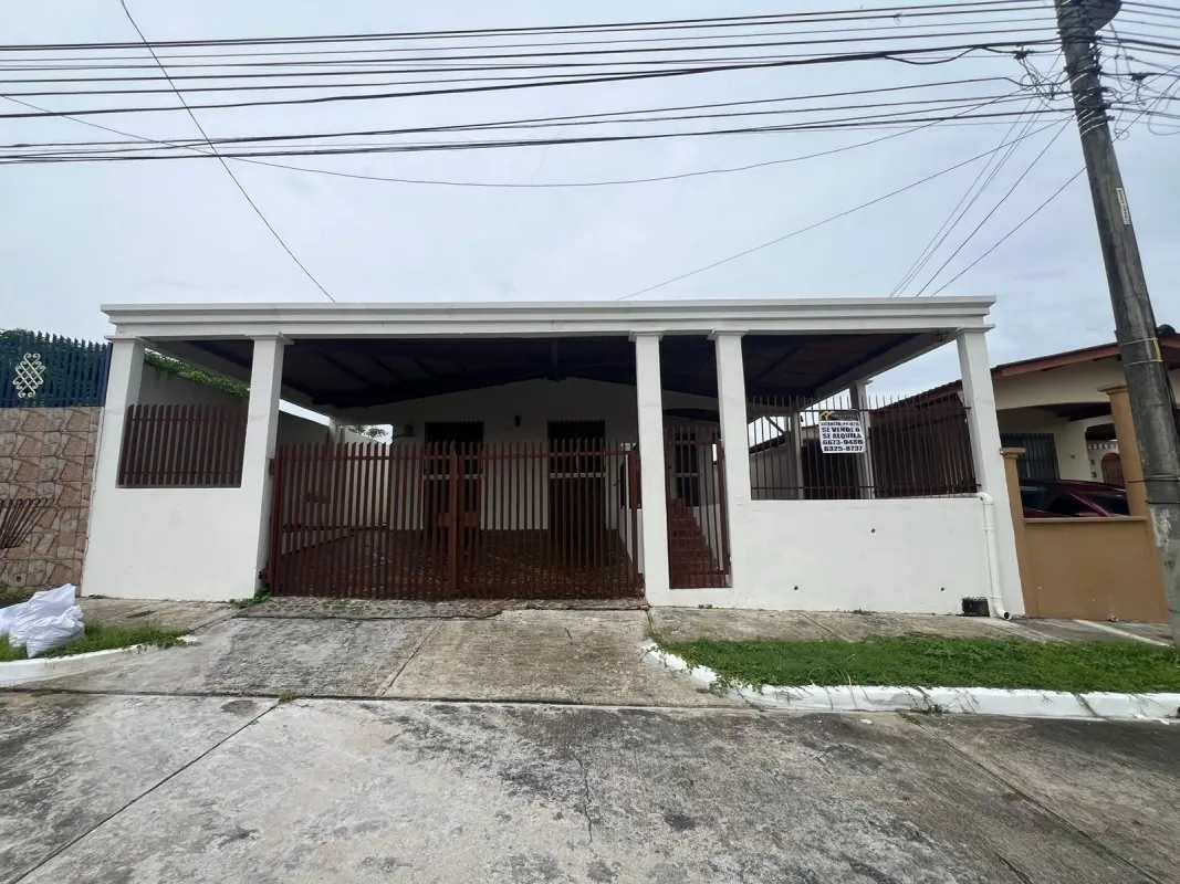 Spacious white kitchen with granite countertops and double sink in Brisas del Golf Panama