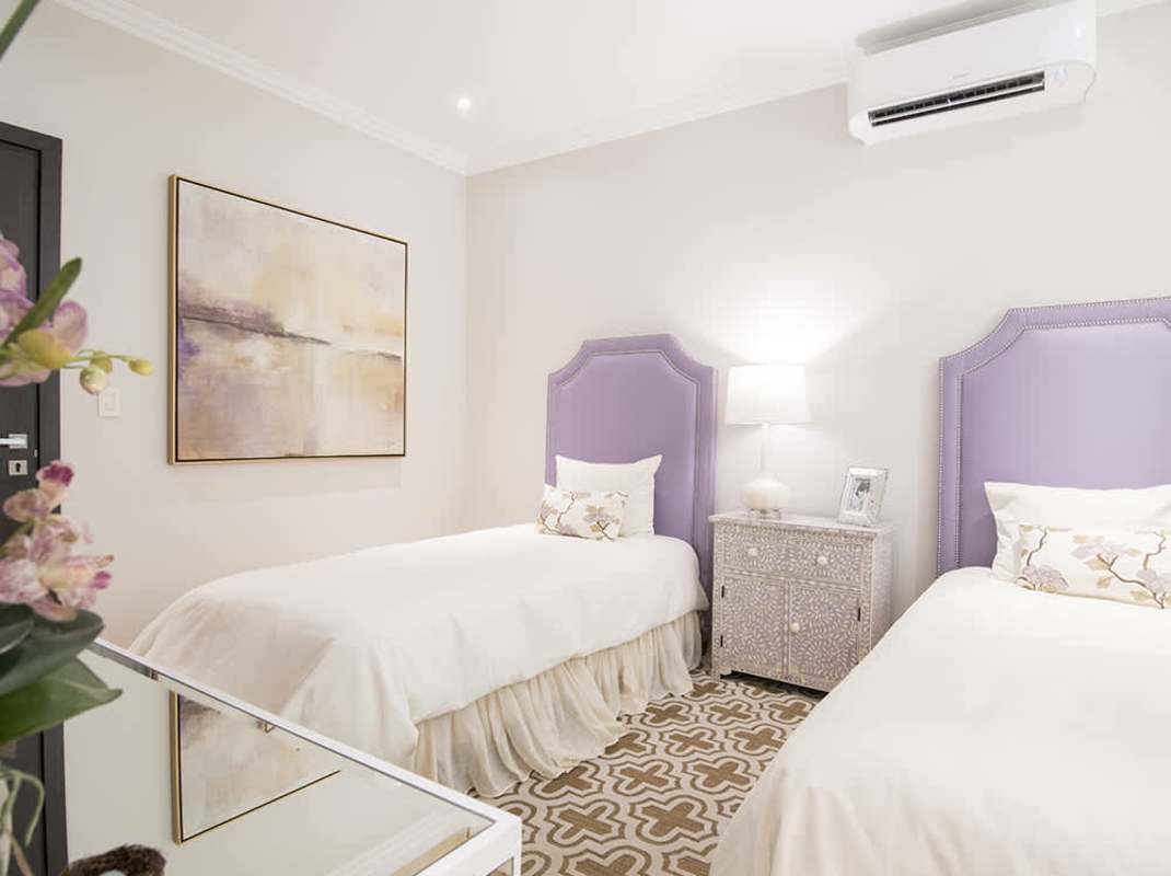 Modern kitchen with granite island and built-in appliances in Santa María Golf residences Panama