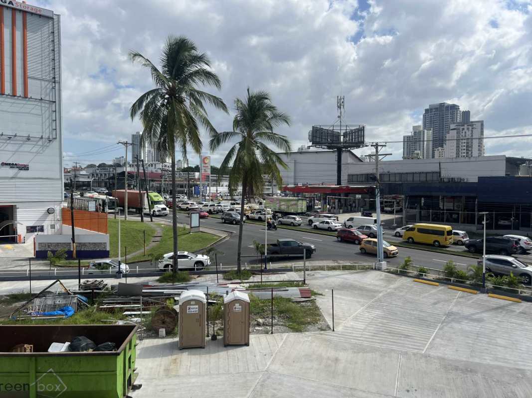 Glass ceiling mall area with escalators and storefronts at Transistmica Business Plaza Panama