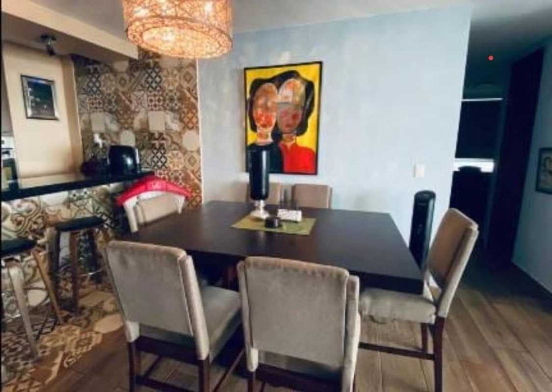 Dining with tile backsplash, modern bar, colorful art PH Terrasol San Francisco Panama