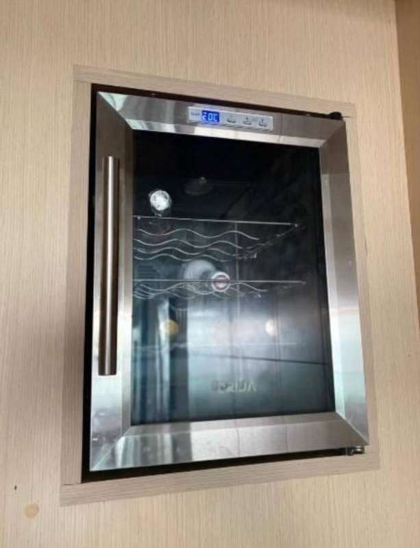 Built-in glass wine cooler in modern kitchen PH Terrasol San Francisco Panama