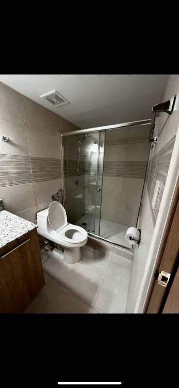 Balcony with cityscape sunset view hanging chair plants PH Residencial El Bosque Panama