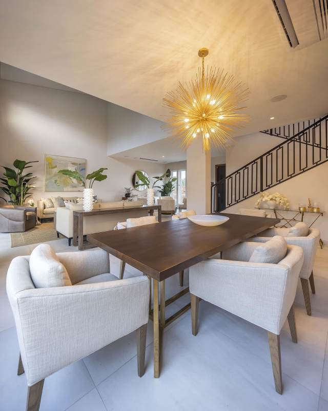 Contemporary minimalist living room with TV, large window, neutral decor Santa María Golf & Country Club Panama