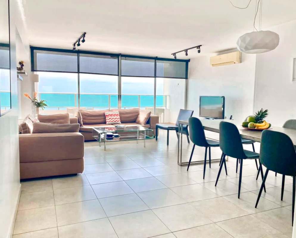 Dining area overlooking ocean with large windows in PH Terrasol San Francisco Panama