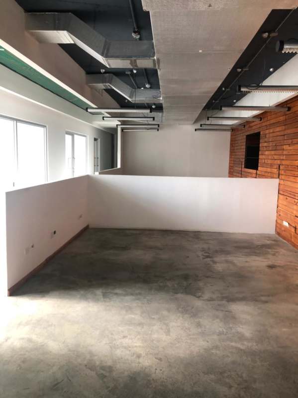 Elegant lobby area with glass doors tile floors recessed lighting PH BICSA Tower Panama City