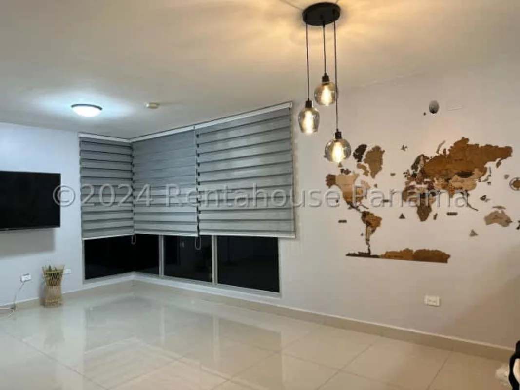 Living and dining space with tile floors in rental apartment Carrasquilla Panama