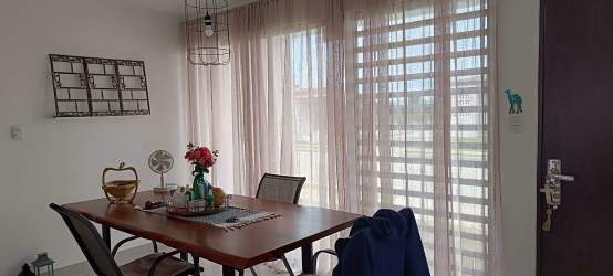Dining room with minimalist decor, large windows, in furnished house Santa Monica Coclé Panama
