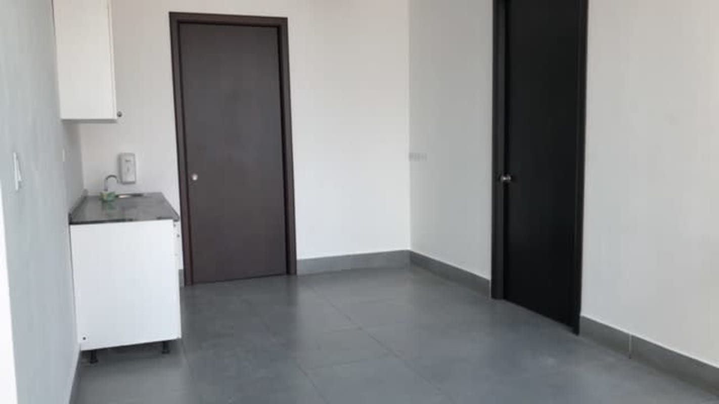 Office kitchenette with cabinets and sink at PH BICSA Tower Panama City