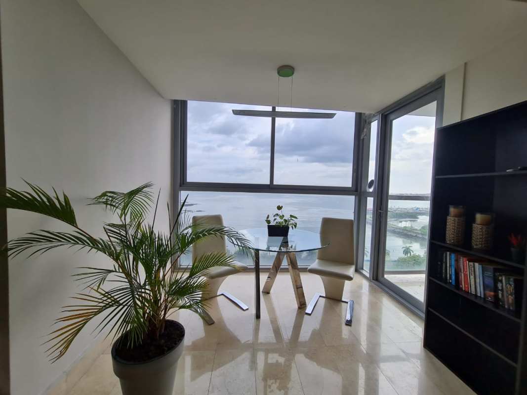 Spacious living area with ocean views in furnished luxury apartment YOO Panama Avenida Balboa