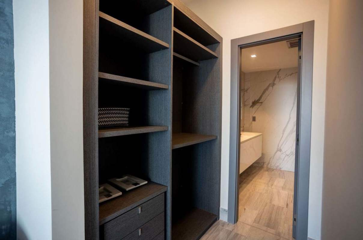 Modern bathroom with marble tiles and elegant fixtures in Armani Residences Panama Bella Vista