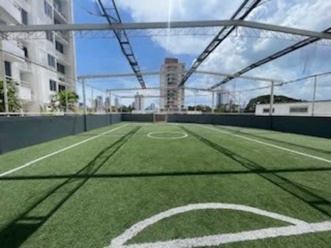 Outdoor mini soccer field with artificial turf on rooftop of PH Splendor by The Park Via España Panama City